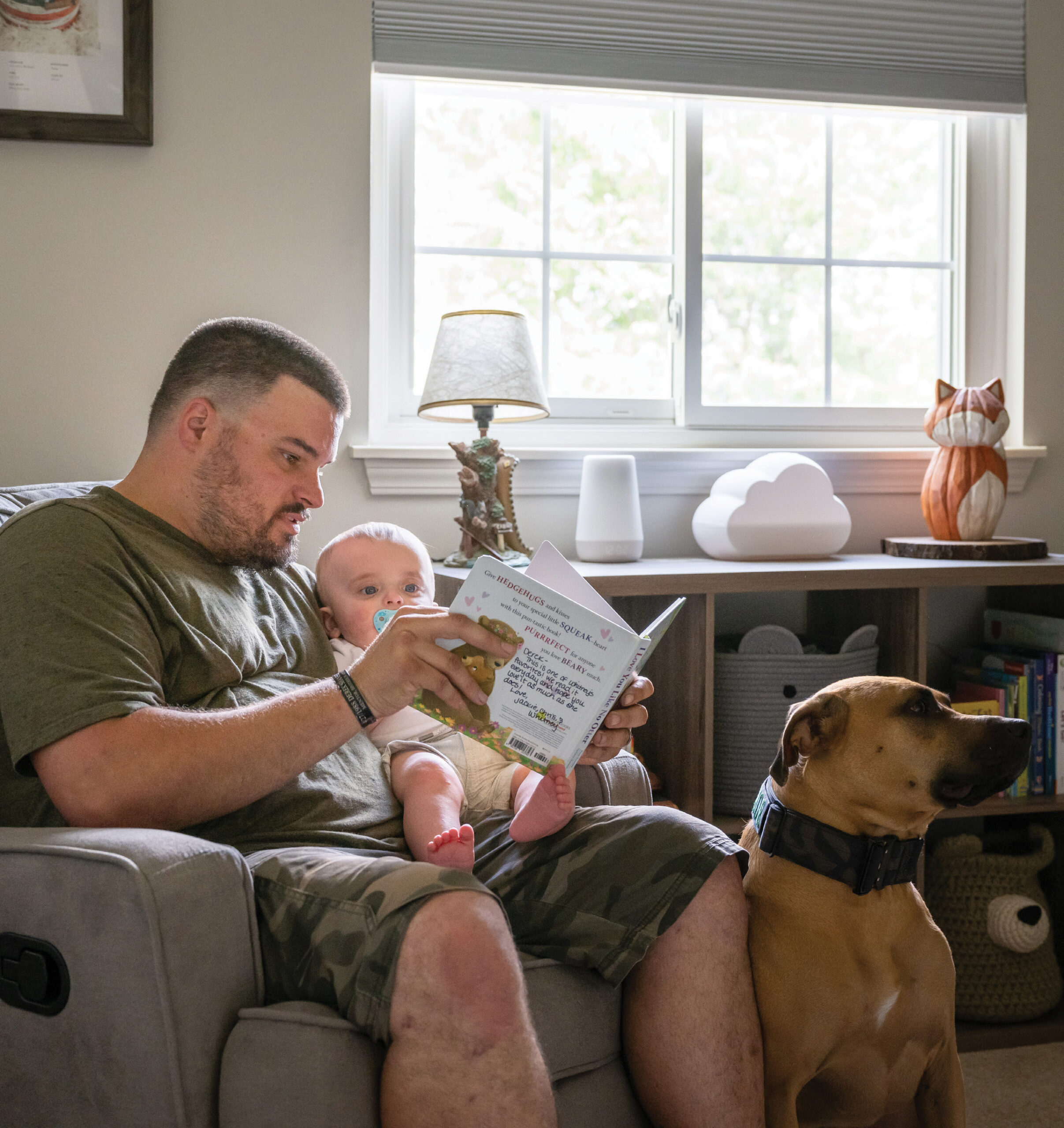A man reading to a baby